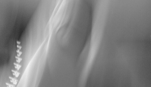 blurry grey white photo image, plays with light nothing specific depicted